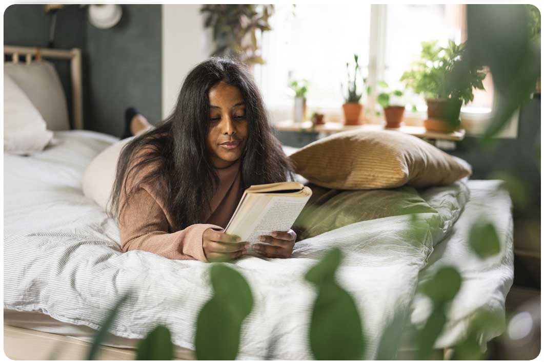 Woman reading on bed