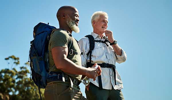 people hiking wearing backpacks