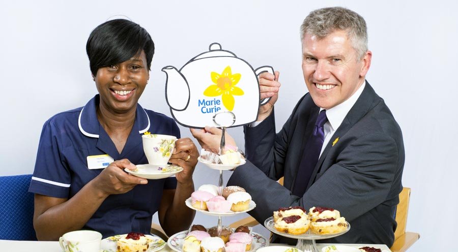 CEO and Marie Curie nurse with teapot and afternoon tea