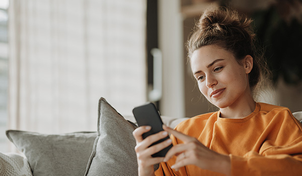Woman checking her maturity account on her phone
