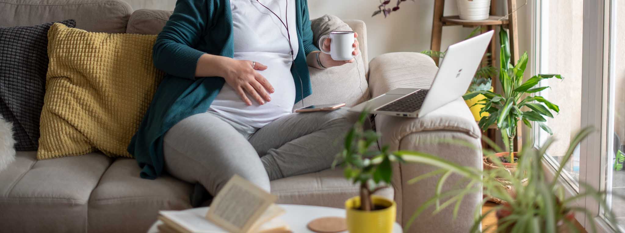 Pregnant woman on laptop