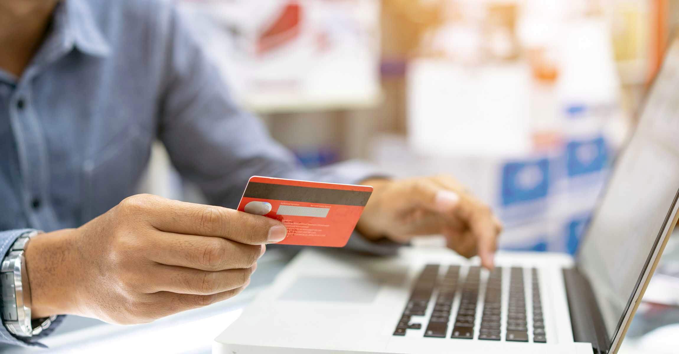 Man using card to pay online