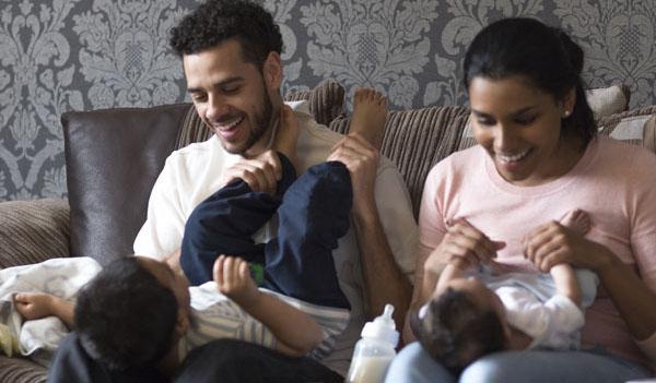 Couple playing with their children