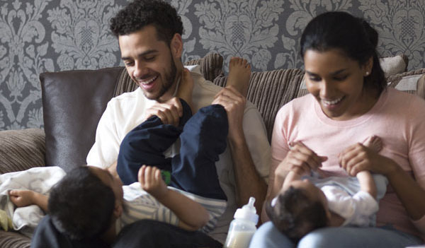 Couple playing with their children