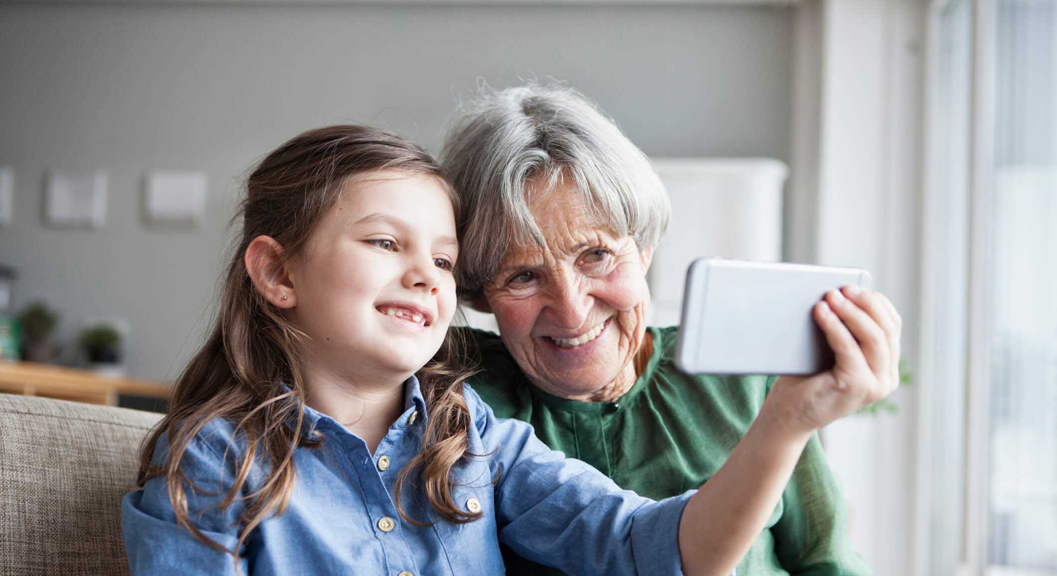 older lady and child with phone