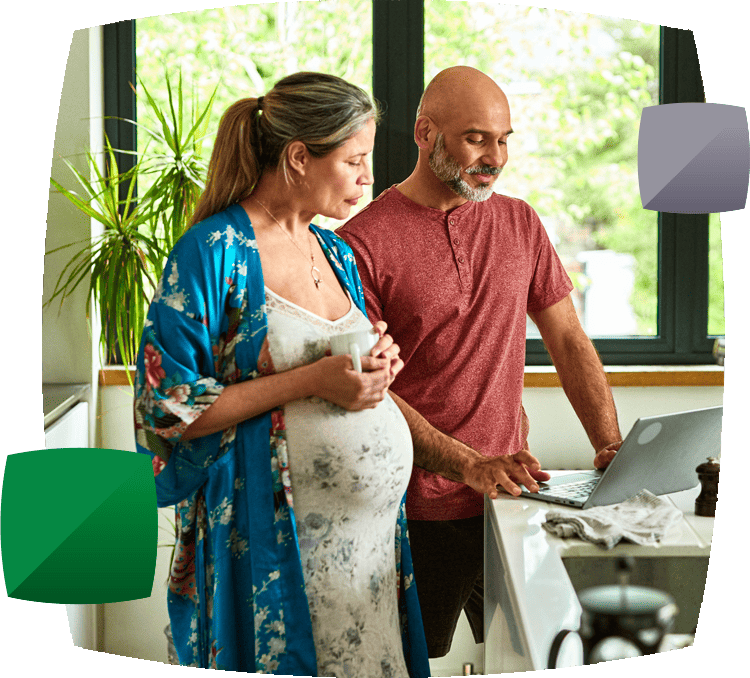 pregnant woman with partner in kitchen