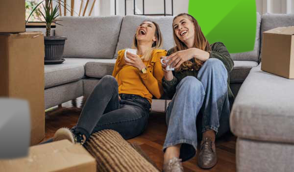 women laughing with coffee