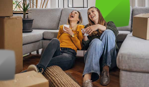 Women laughing with boxes
