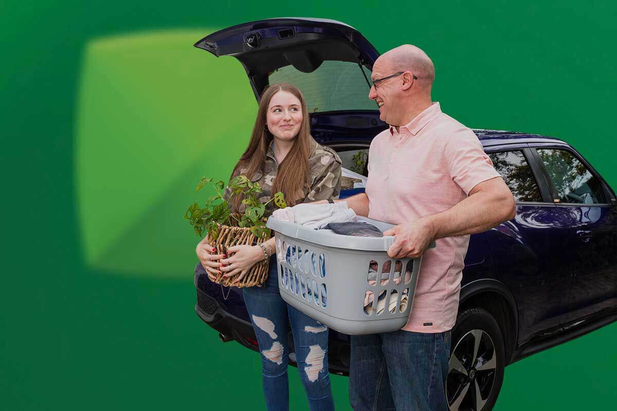 Father and daughter packing car