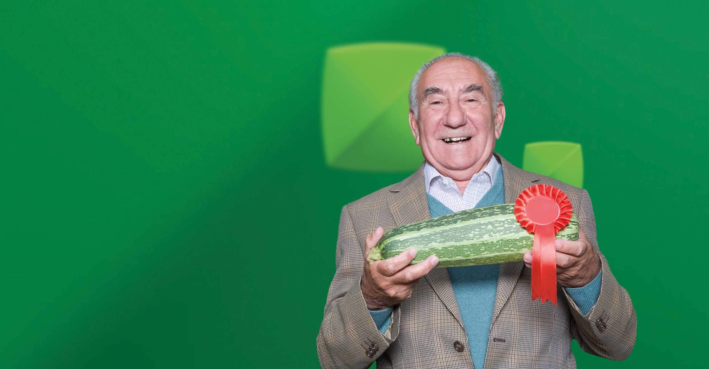 Man holding prize winning marrow