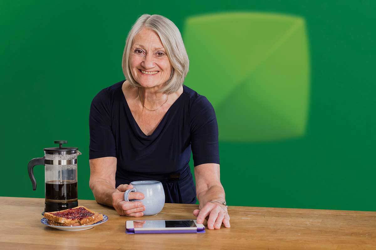 Woman smiling with coffee