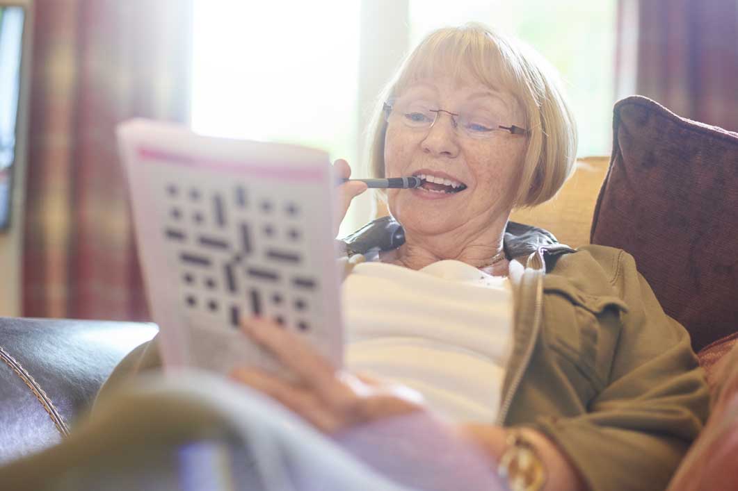 woman doing crossword