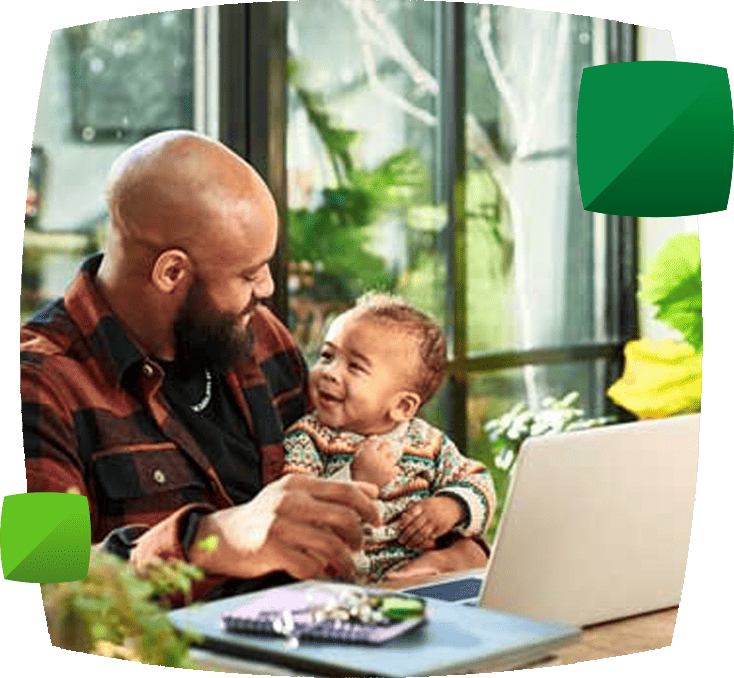 Man with laptop and child
