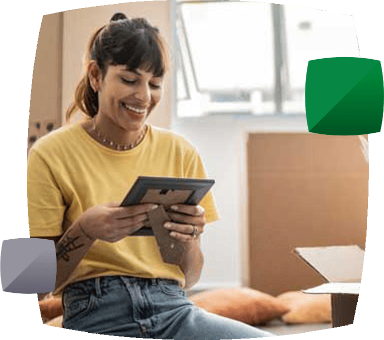 Woman packing looking at photo