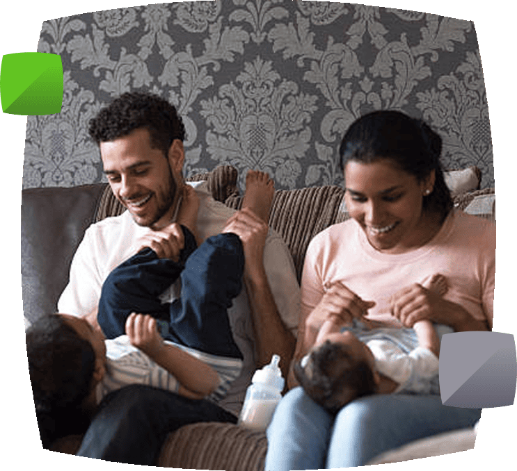 Family playing on sofa