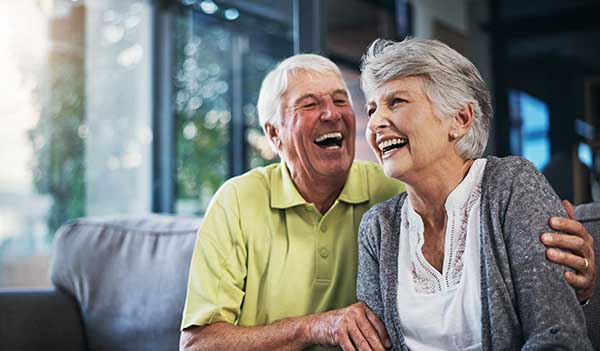 retired couple laughing