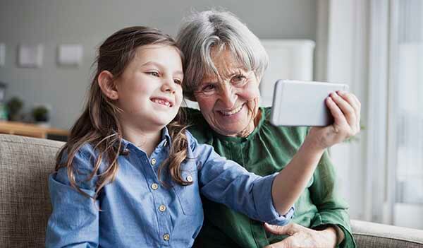 Grandma and child taking picture