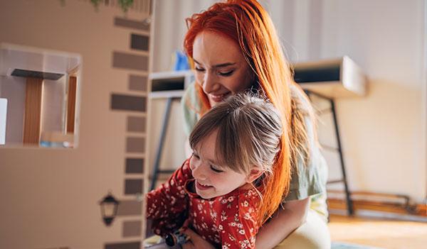 Woman hugging small child